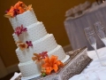 Four tier white wedding cake with flowers
